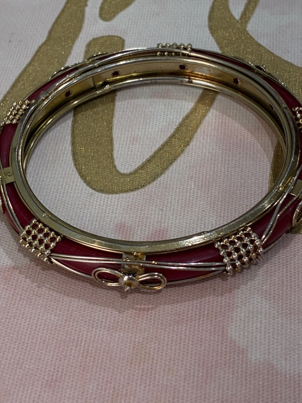 Gold-Tone Pink Enamel Bangle Bracelet with Bow Accent